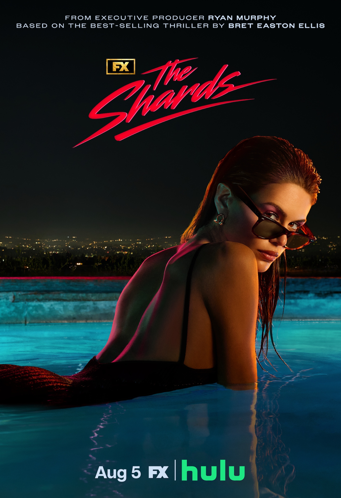 FX's The Shards Kaia Gerber halfway in a swimming pool wearing a black swimsuit and sunglasses at night.