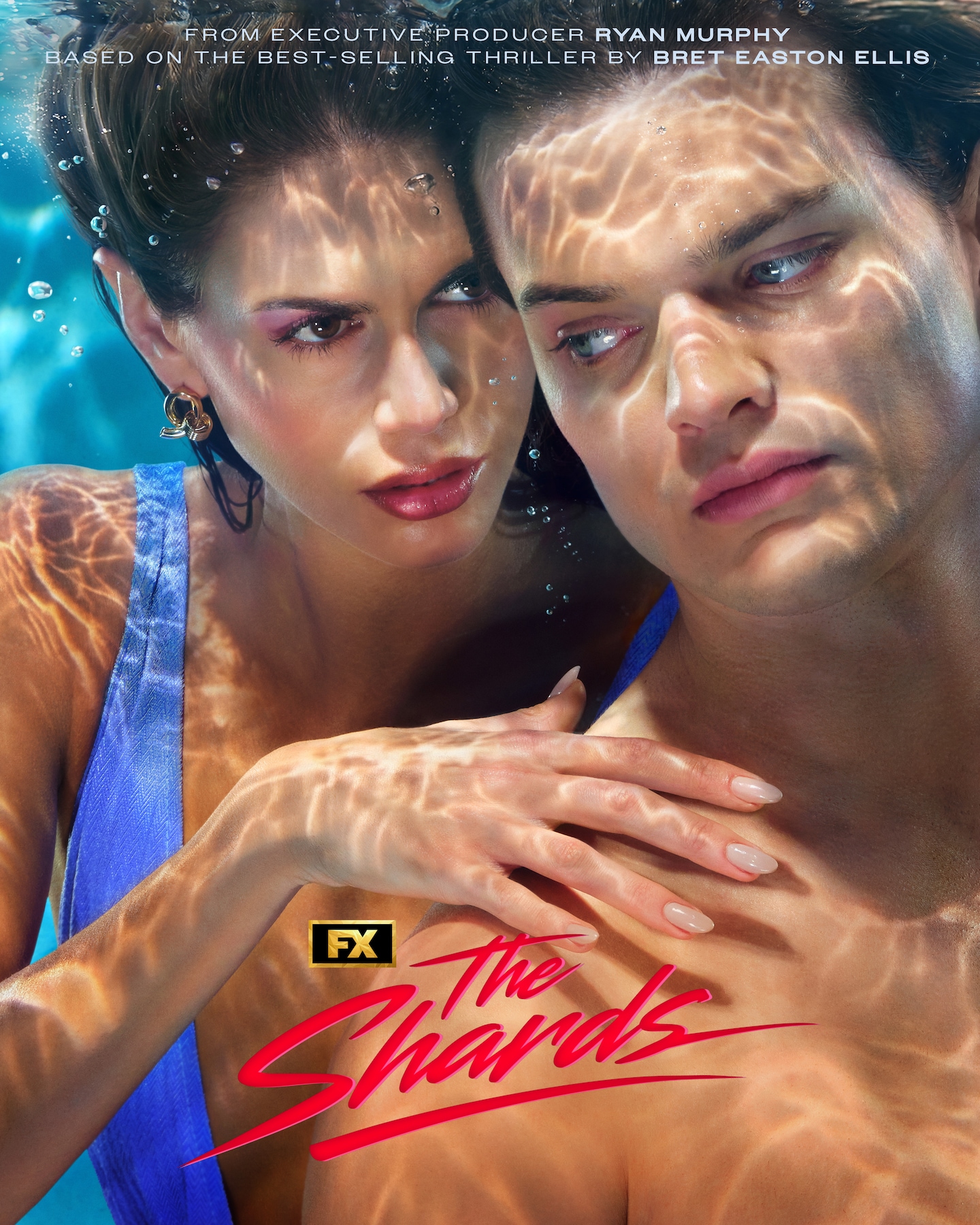 FX's The Shards Kaia Gerber and Homer Gere underwater in a swimming pool as Gerber wraps her arm around Gere.