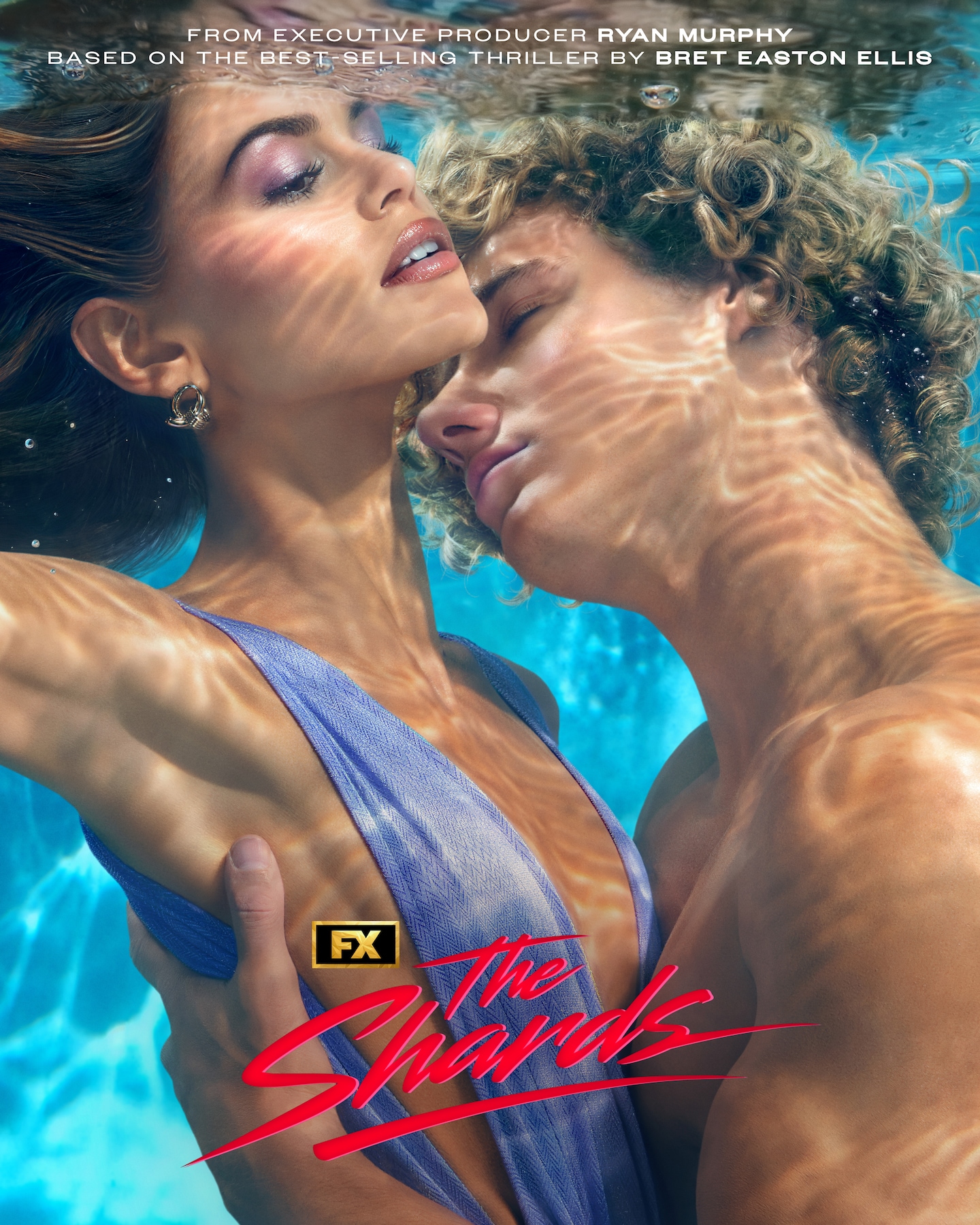 FX's The Shards Kaia Gerber and Graham Campbell under water in a pool embracing each other.