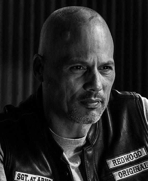 David Lebrava headshot wearing a "redwood original" jacket