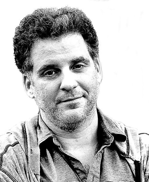 Andrew Gurland headshot wearing a gray shirt