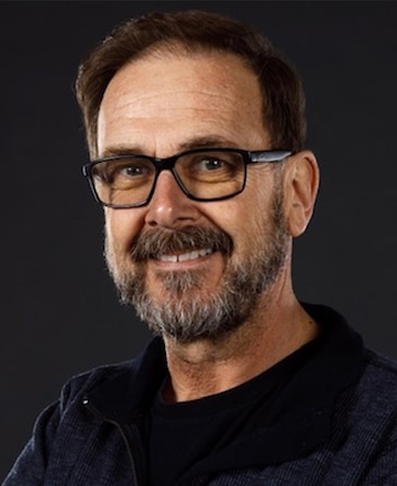 Chris Long headshot wearing black sunglasses and black shirt