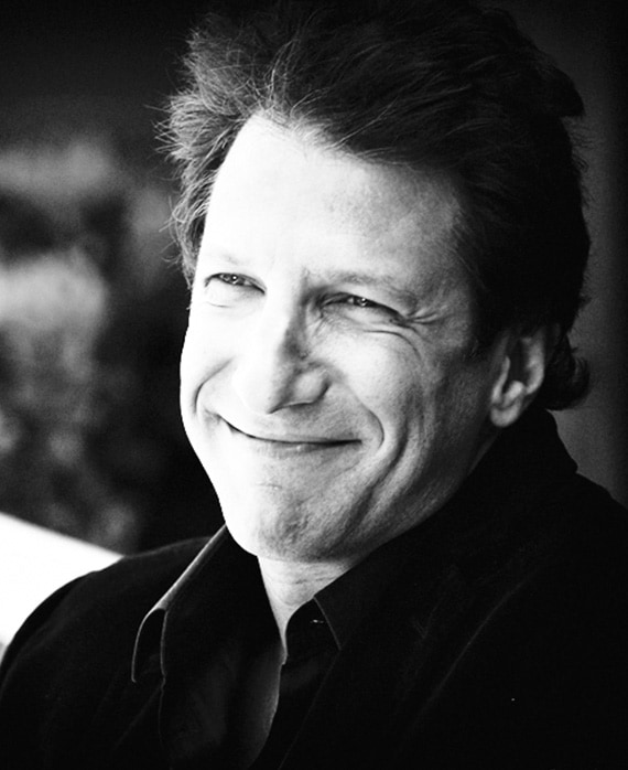 Jeffery Kwatinetz headshot wearing a black collared shirt