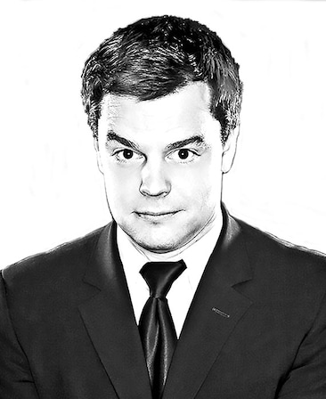 Headshot of BJ Porter, Executive Producer of FX's Married, wearing a suit and tie