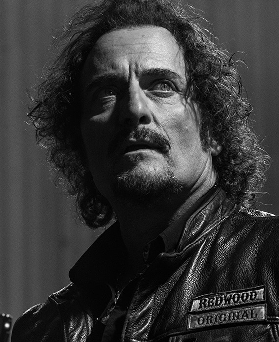 Kim Coates headshot wearing a "redwood original" jacket
