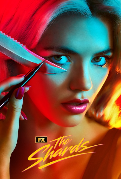 Hayes Warner facing the camera while applying makeup with a knife and eyeliner