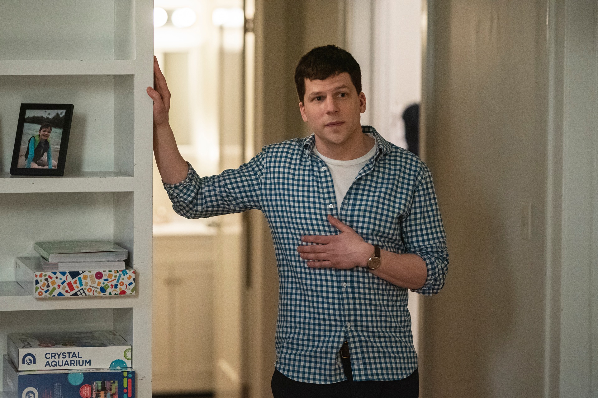 Toby Fleishman wearing a blue plaid shirt and standing in a doorway