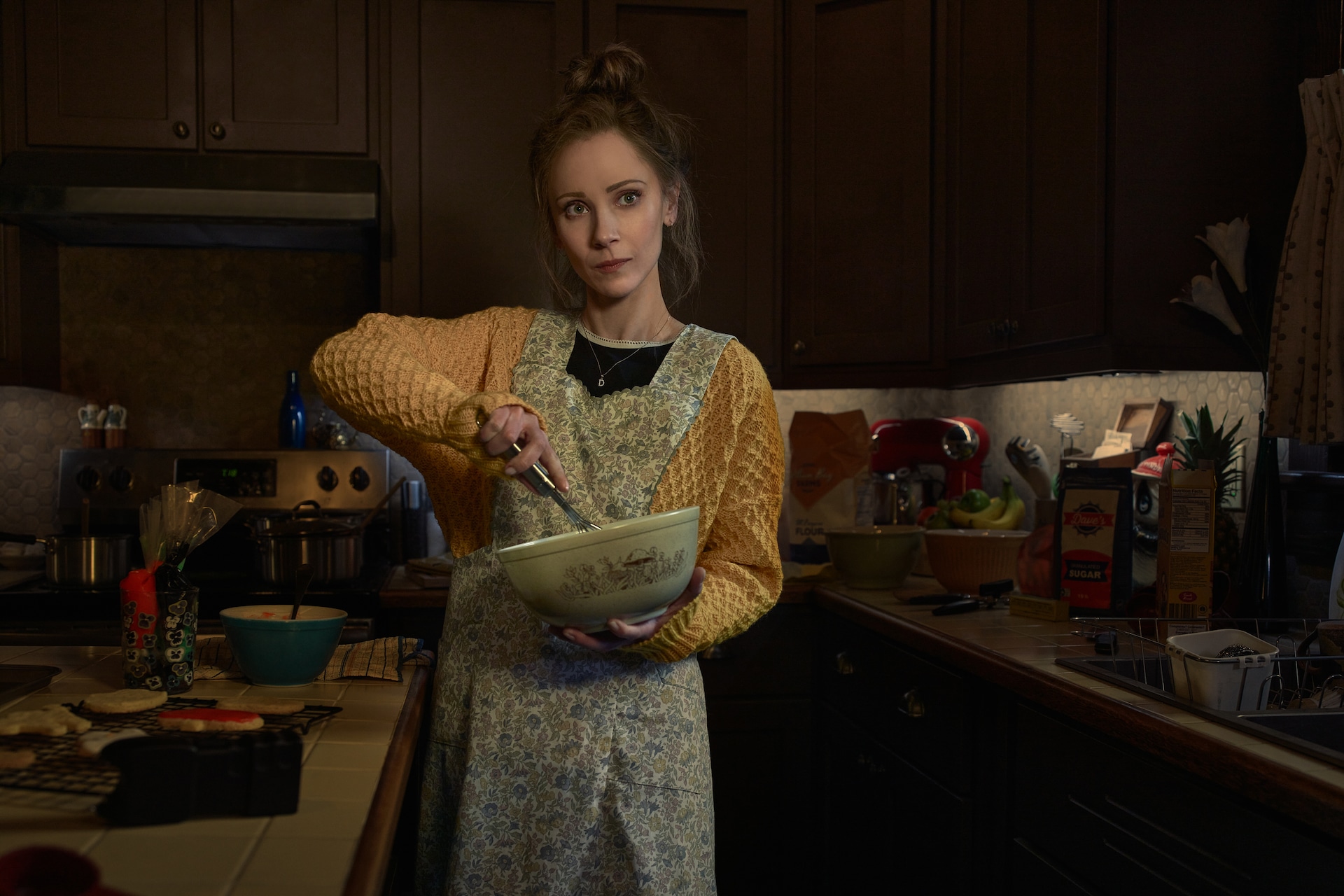 Dorothy “Dot” Lyon in kitchen with a battering bowl.