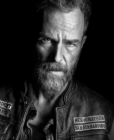 JR Bourne headshot wearing a "Men of Mayhem San Bernardino" leather jacket