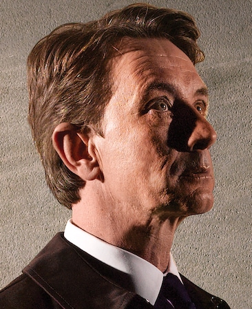 Martin Short as Leonard Winstone in FX's Damages, in brown coat and white button down