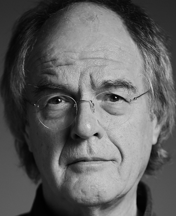 Chips Hardy Headshot wearing glasses in a black and white filter