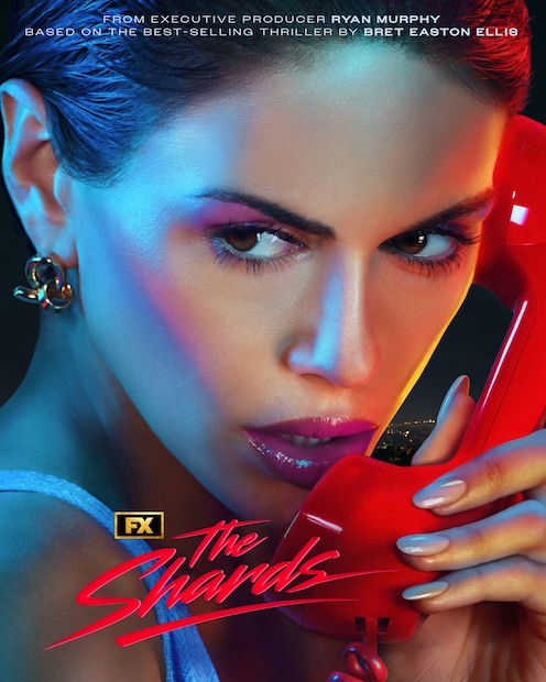 FX's The Shards Kaia Gerber picking up a red phone looking away from the camera with pink makeup and nude nails.
