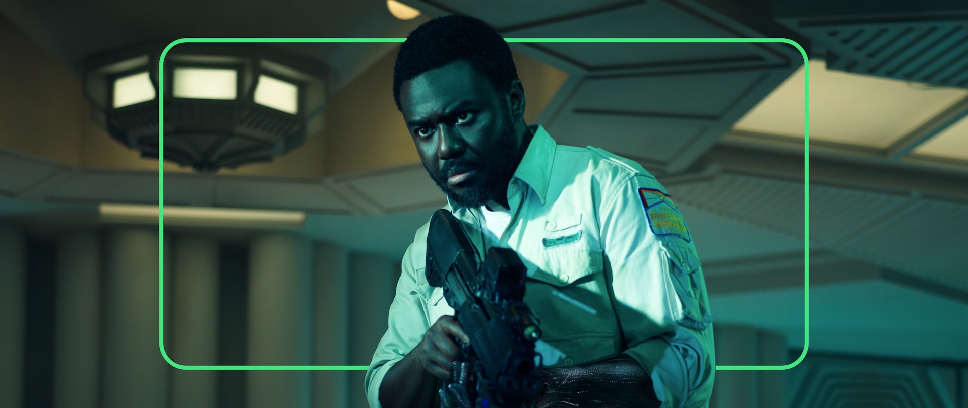 Close up of Morrow from FX's Alien: Earth holding a gun.