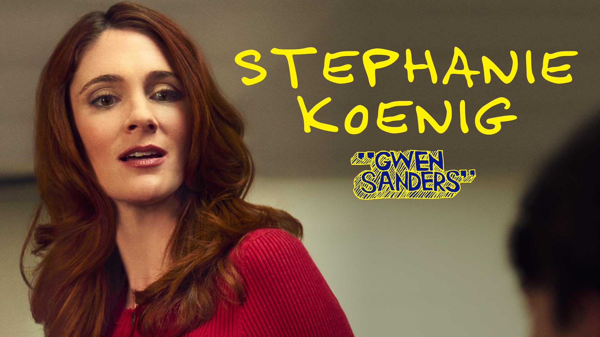 Stephanie Koenig as Gwen Sanders for FX's English Teacher wearing a bright red shirt facing the side, smiling.
