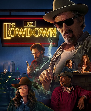 Cast of the Lowdown with several sitting around a diner table and a city at dusk in the background.