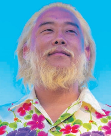 David Choe headshot in white collared shirt with bright green, pink, and purple flowers and bright blue background