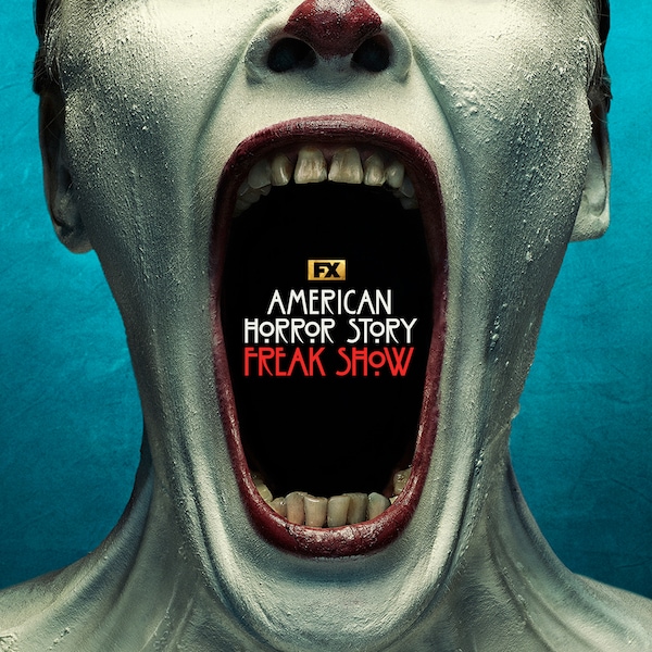 Close up of elongated open mouth with yellowed teeth, dark red lips, and white face and body paint for AHS: Freak Show.
