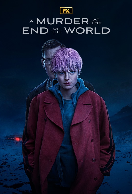 Darby Hart wearing a red jacket as a man stands behind her peaking over her shoulder and a building secluded in the distance.