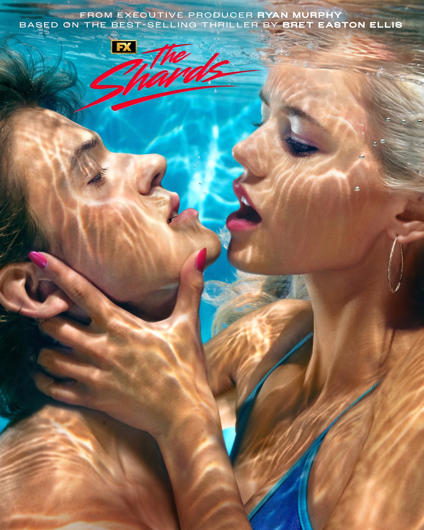 FX's The Shards Hayes Warner and Igby Rigney under water in a pool embracing each other.