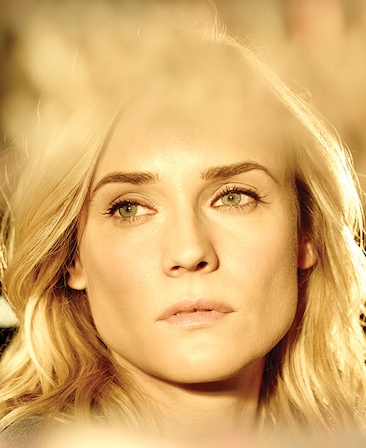 Diane Kruger headshot with very bright light shining down on fact and top and bottom of headshot slightly blurred