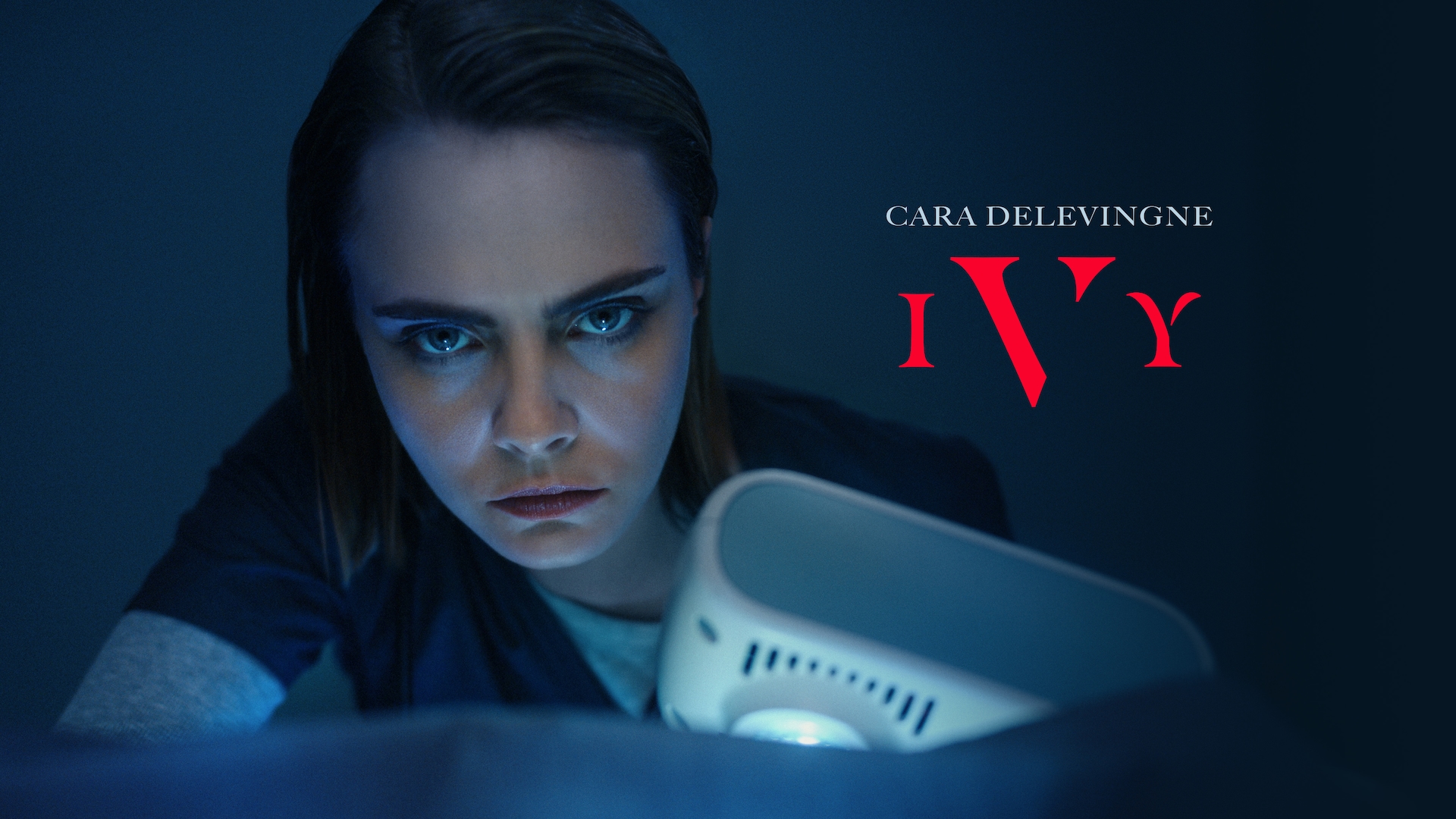 Cara Delevingne headshot wearing scrubs in a dark settings for AHS: Delicate