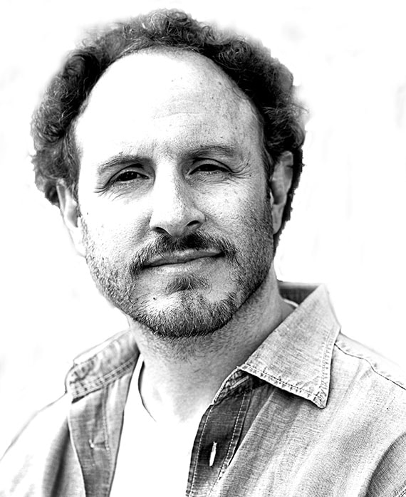Salamo Levin headshot wearing a white shirt and button up
