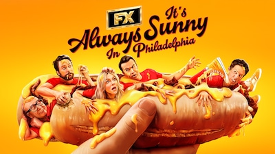 The Always Sunny cast crawling out of a large hotdog with ketchup and mustard.