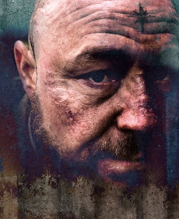 Stephen Graham Headshot with cuts on his face and a star tattooed on his forehead