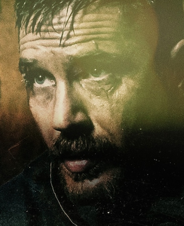 Tom Hardy Headshot with eyebrows raised and wrinkles on forehead