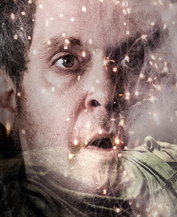 Tom Hollander Headshot with raised eyebrows and mouth open