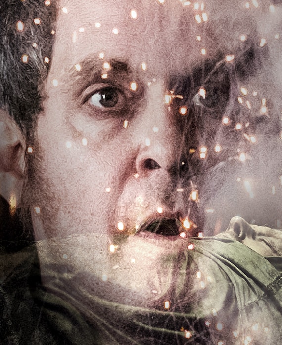 Tom Hollander Headshot with raised eyebrows and mouth open