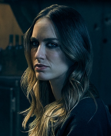 Ruta Gedmintas Headshot wearing dark eye makeup and long wavy hair