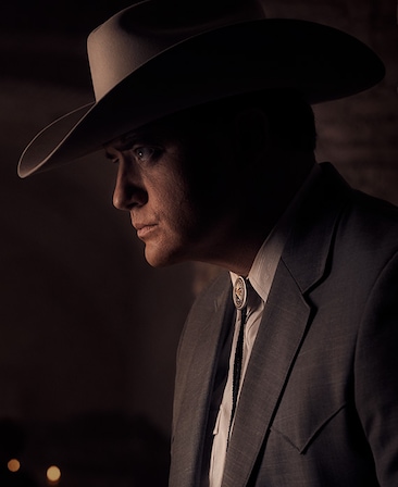 Brendan Fraser Headshot wearing a big hat and suit