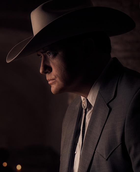 Brendan Fraser Headshot wearing a big hat and suit