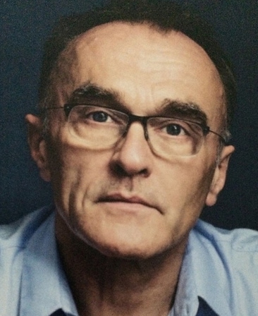 Danny Boyle Headshot wearing a blue shirt and glasses