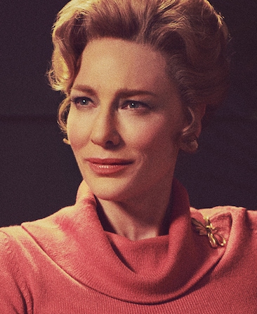 Cate Blanchett headshot wearing a pink sweater and brooch 