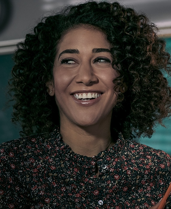 Marielle Scott Headshot wearing a floral shirt
