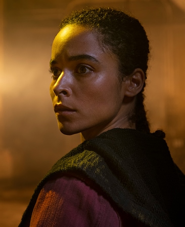 Juliana Canfield headshot wearing a red and black jacket