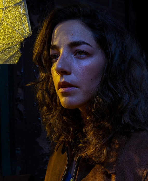 Olivia Thirlby headshot wearing a brown jacket