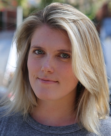 Eliza Clark headshot wearing a gray shirt