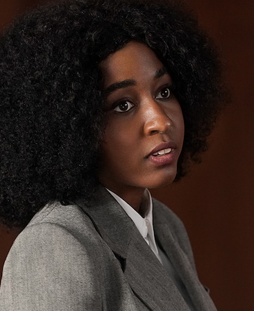 Ayo Edebiri headshot wearing a gray blazer jacket and white shirt