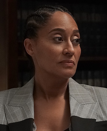 Tracee Ellis Ross headshot wearing a gray plaid jacket