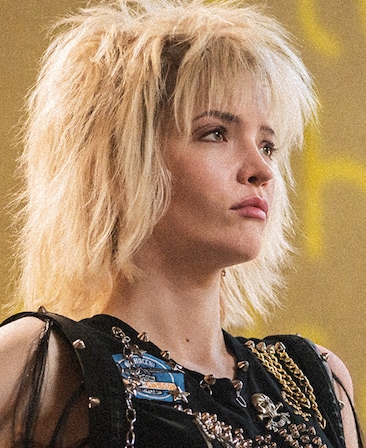 Talulah Riley headshot wearing a black top with chains on it