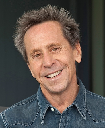 Brian Grazer headshot wearing a denim top 