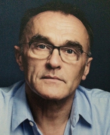 Danny Boyle Headshot wearing a blue shirt and glasses