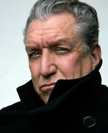Steve Jones headshot wearing a big black coat covering his neck