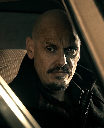 Scott Ryan headshot sitting in a car wearing a black jacket