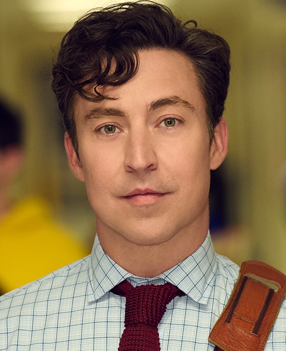 Brian Jordan Alvarez as Evan Marquez for FX's English Teacher, wearing white patterned button up and red tie.