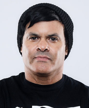Elgin James headshot wearing a black beanie and black shirt
