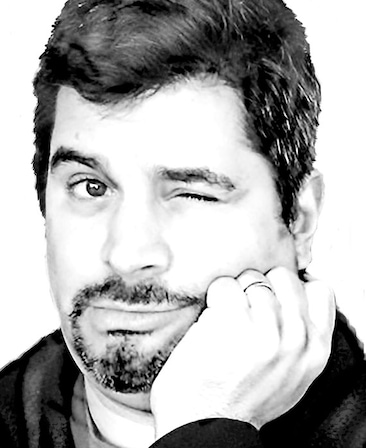 Ari Posner headshot placing his hand on his cheek and winking with one eye
